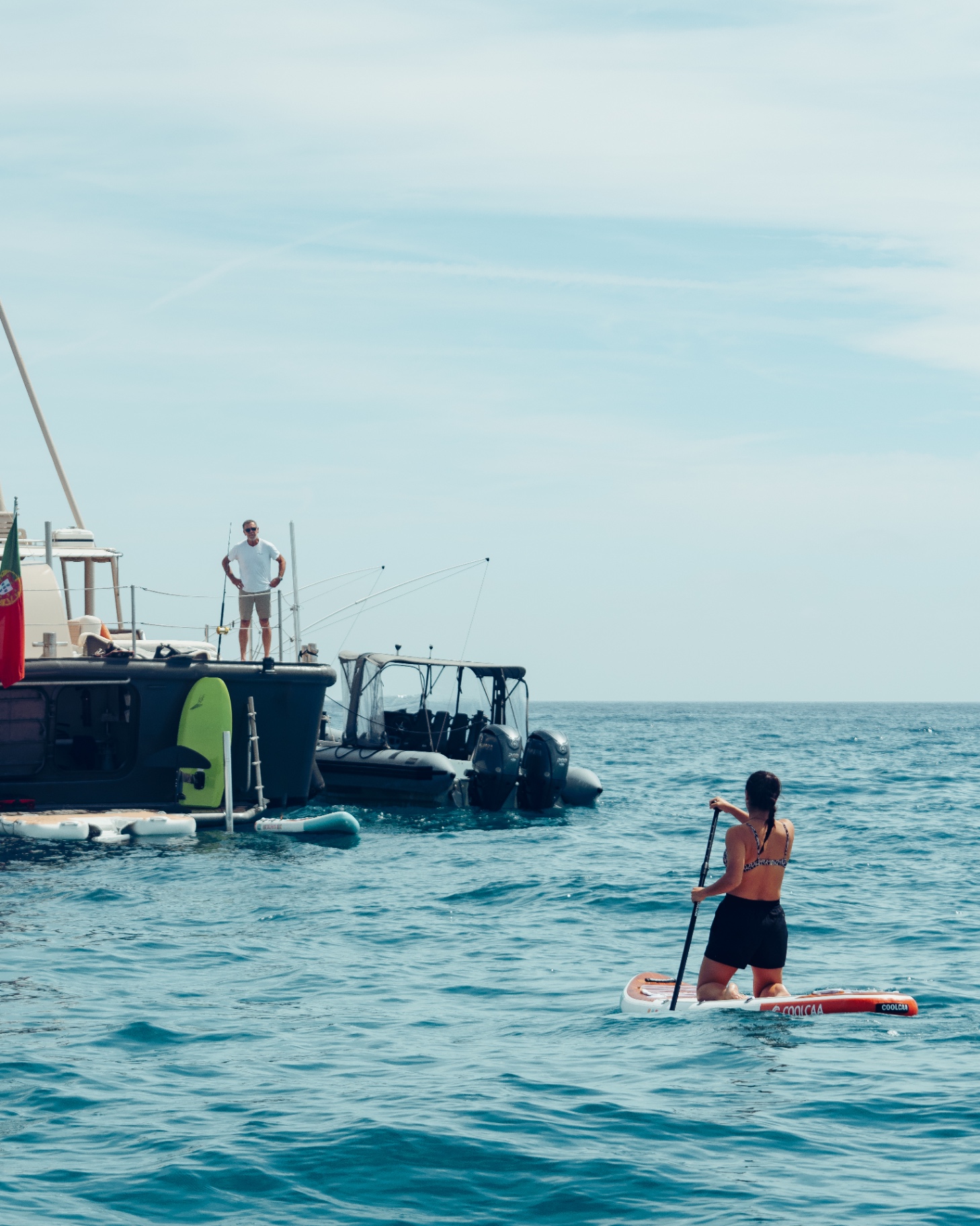 Paddleboarding from the yacht's swim platform